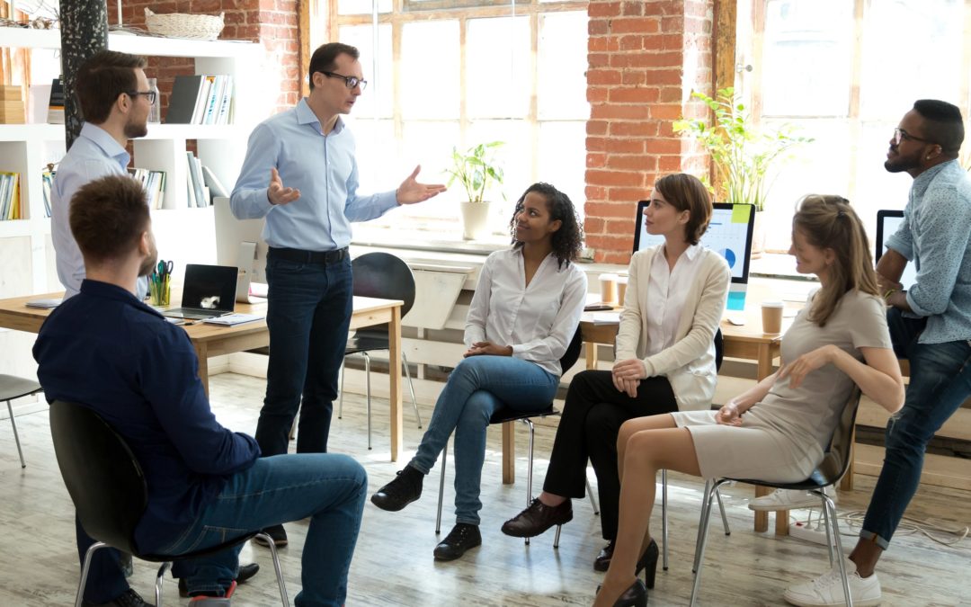 A group of people in a meeting